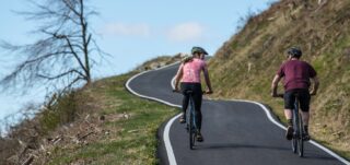 Marin Fairfax riders, climbing a hill, UK.