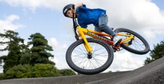 Boy riding a Marin Alcatraz 24 on a pump track.