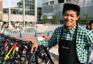 Man stands with bikes