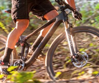 man rides bike