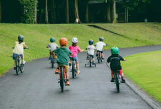 Kids riding Donky Jr kids bikes on a path, Japan.