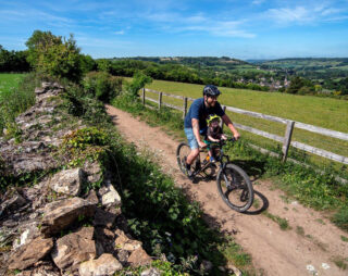 Father and son ride mountain bike with Kids Ride Shotgun Childs Bike Seat