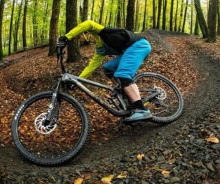 Man rides bike round corner