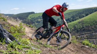 Rider Nikki Whiles riding a Rift Zone 29 on a mountain trail, Wales UK.