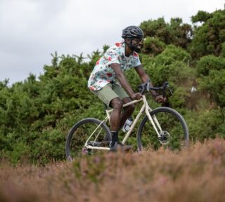 Man climbing a hill aboard a Marin Nicasio 1 gravel bike.