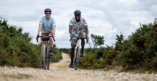 Two riders on Marin Nicasio bikes on a gravel road, UK.